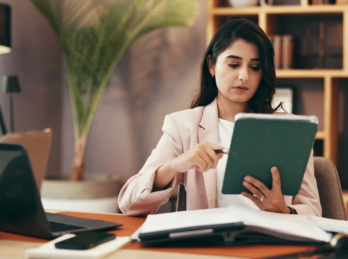 Government Worker Looking At Paper Backlogs
